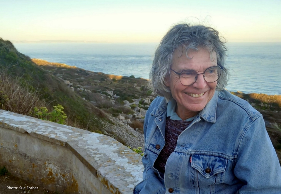 A portrait photograph of the author from the waist up